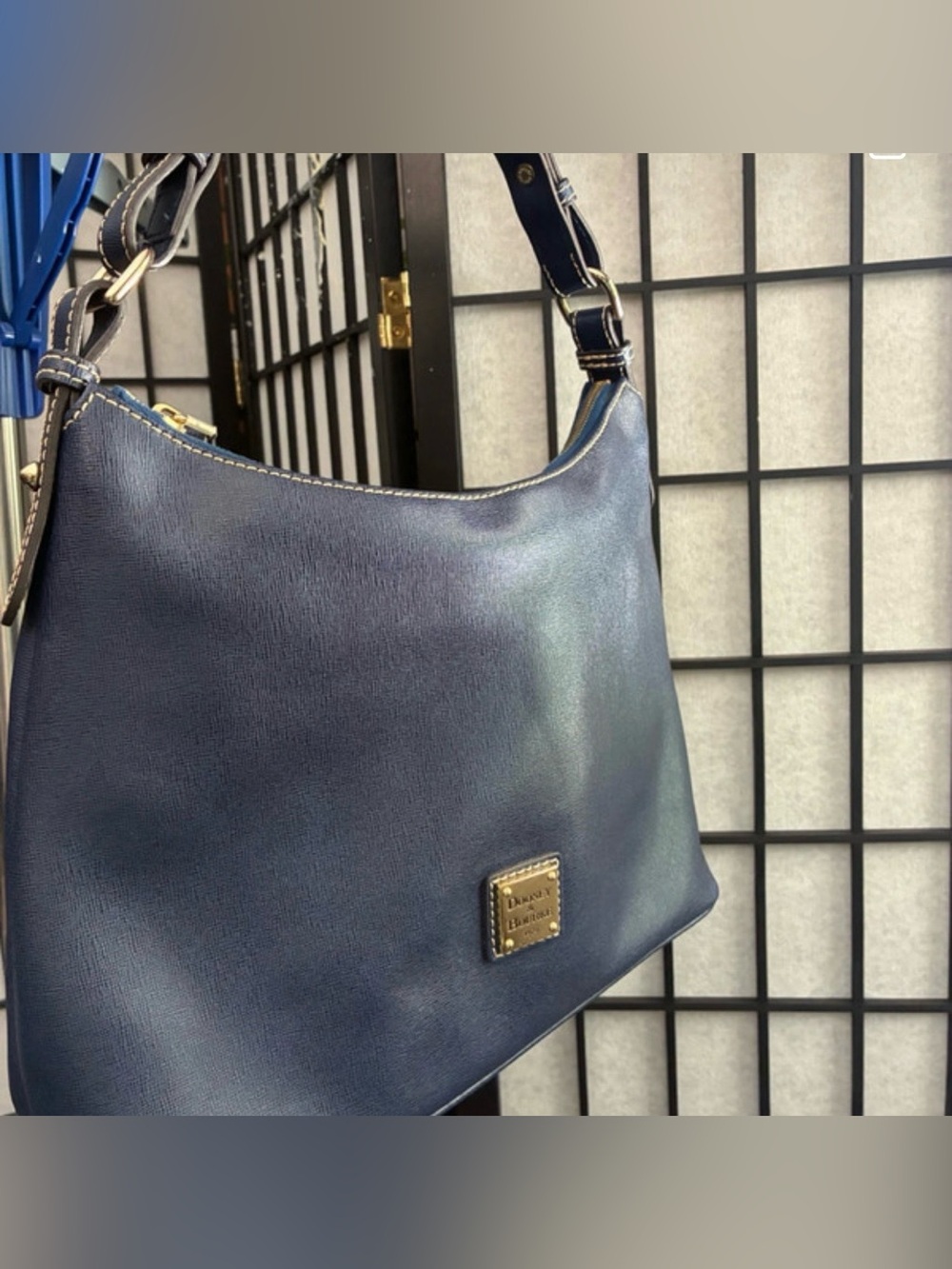 Dooney & Bourke hobo shoulder bag crafted from deep navy blue textured leather